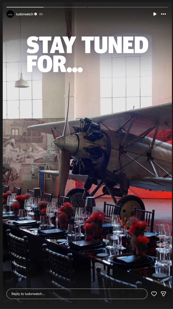 Tudor Instagram teaser reading "Stay tuned for…" over a vintage biplane parked in a hangar set for an event